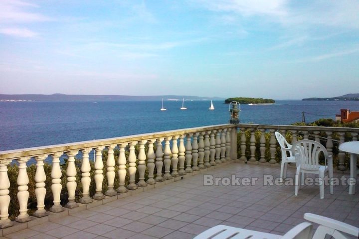 The house in second row from the sea