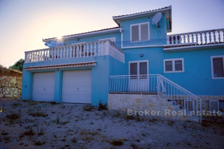 The house in second row from the sea