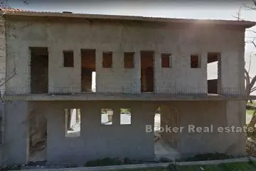 Unfinished house in the first row by the sea on three floors