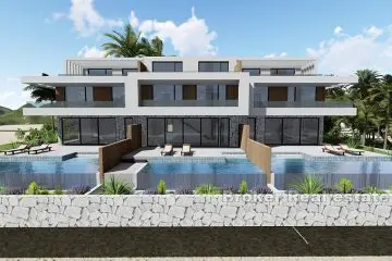 House with a pool in the second row to the sea