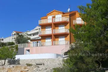 Apartment house with pool first row to the sea