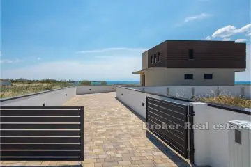 Modern villa first row to the sea