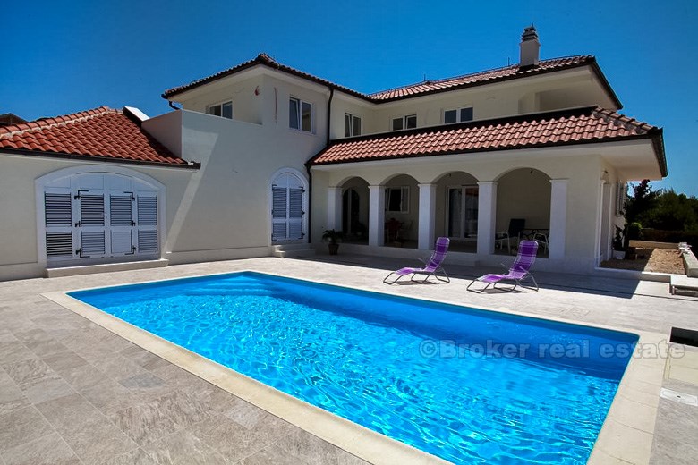 Family villa with swimming pool and open sea views