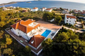 Family villa with swimming pool and open sea views