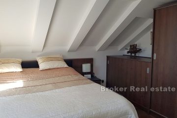 Comfortable attic apartment with a view of the city