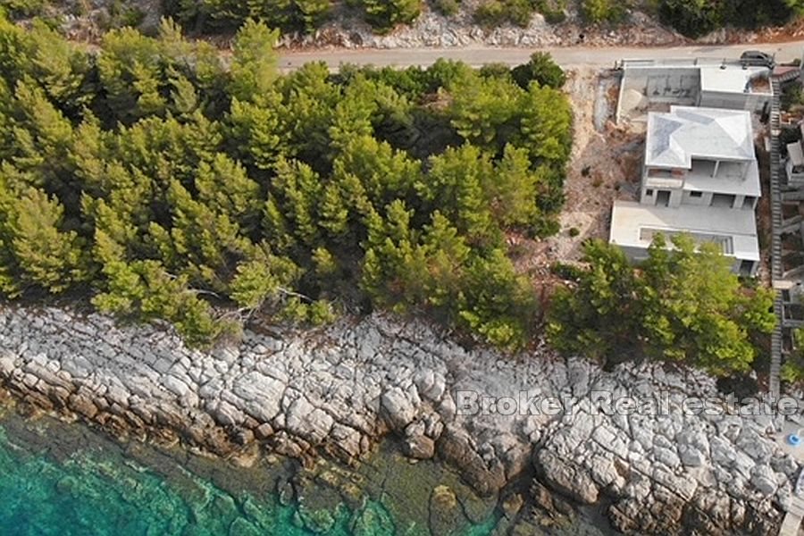 Unfinished house with pool, first row to the sea