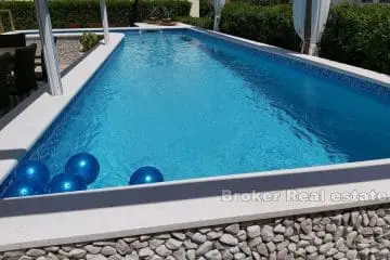 Apartment house with pool, second row from the sea