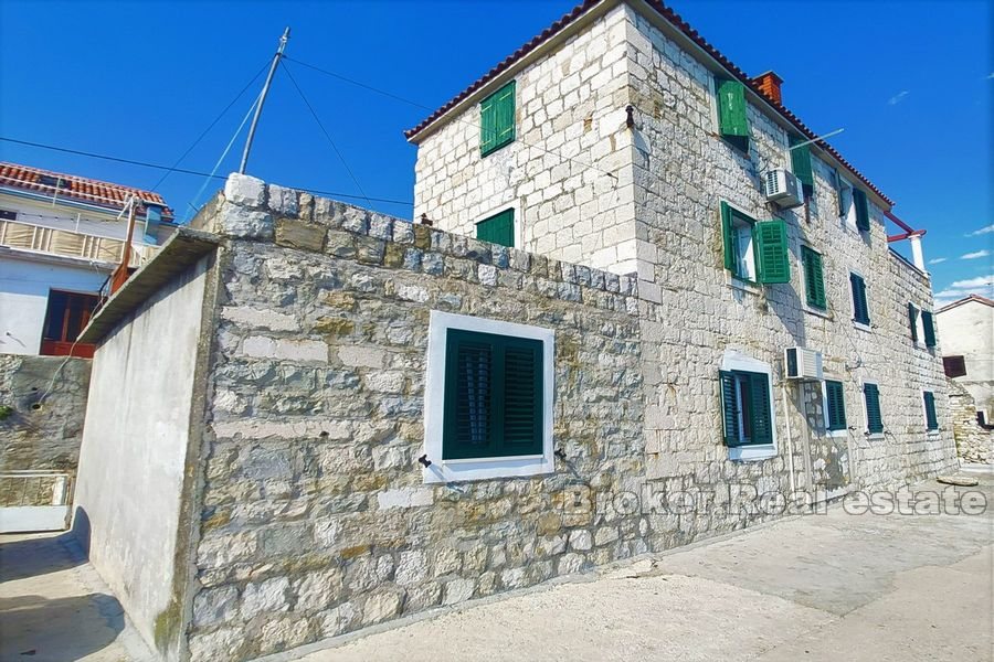Traditional stone house first row to the sea