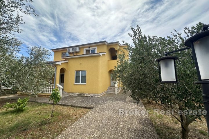 Two detached houses with a large garden 