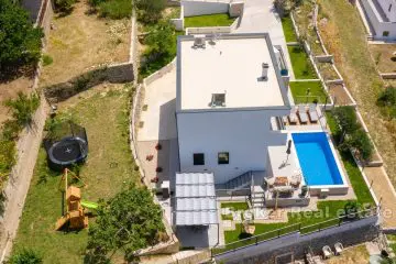 Family villa with a large yard and sea view