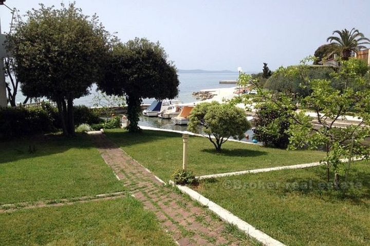 House with land by the sea