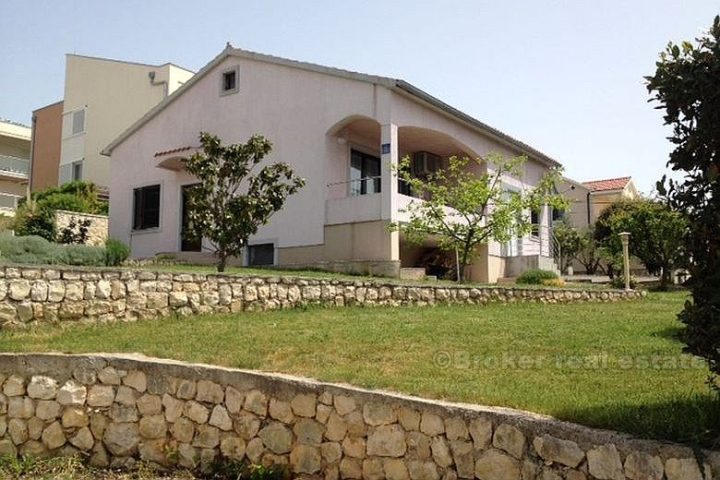 House with land by the sea