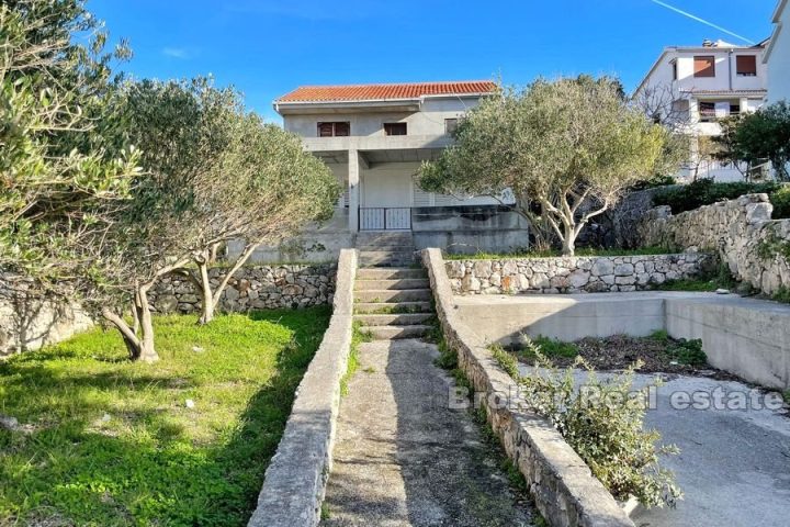 Unfinished house at first row to the sea