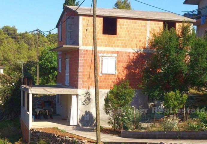 Detached unfinished house on three floors