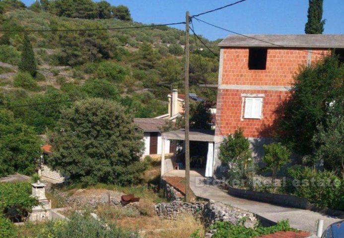 Detached unfinished house on three floors