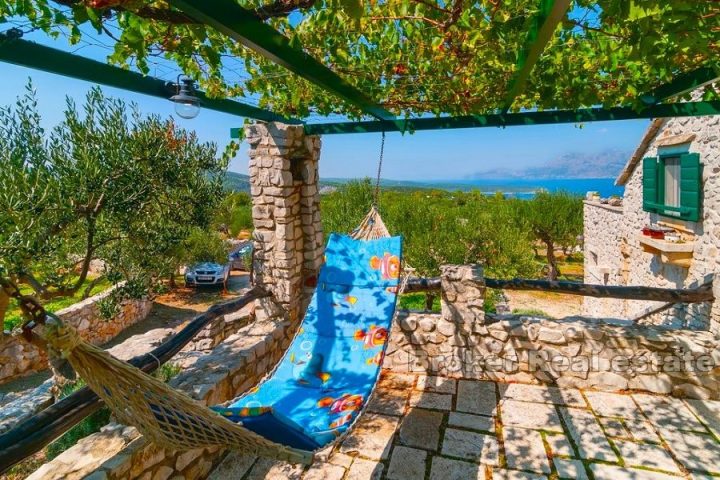 Stone house with olive grove and sea view