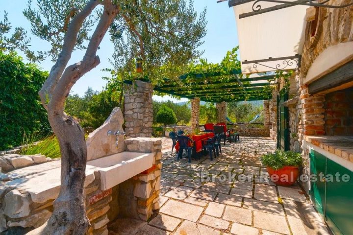 Stone house with olive grove and sea view