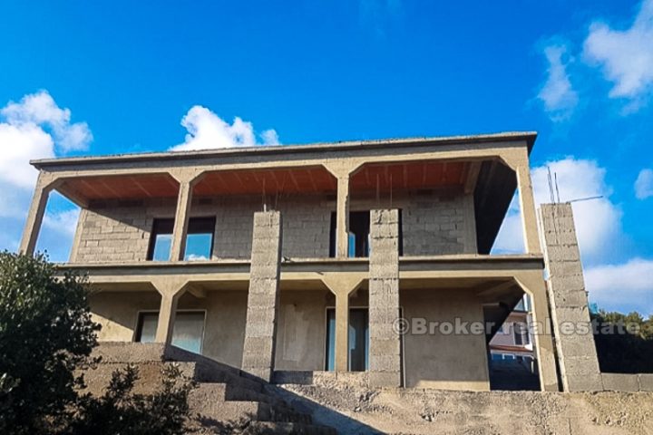 An unfinished house near the sea, on sale