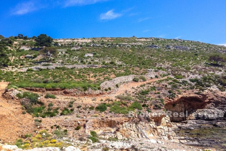 Agricultural land by the sea with ruin, seafront