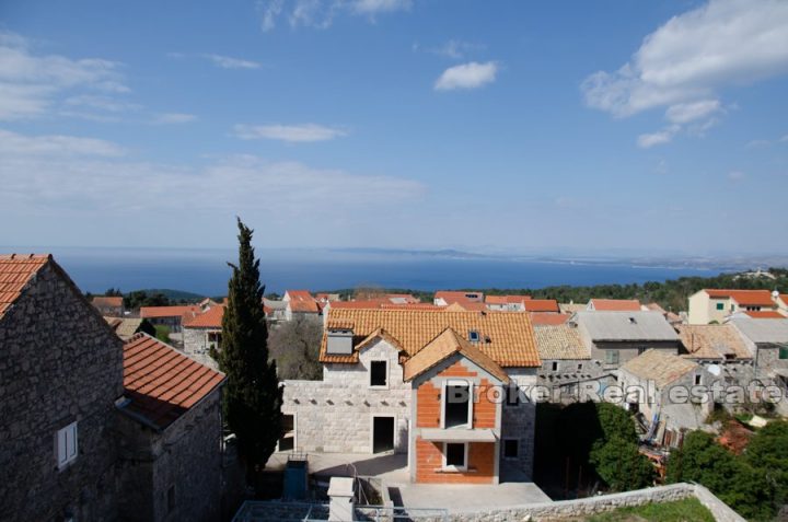 Stone house in a row with sea view