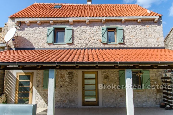 Stone house in a row with sea view